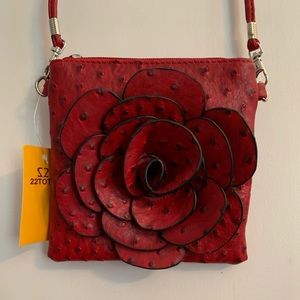 Across body rose leather purse